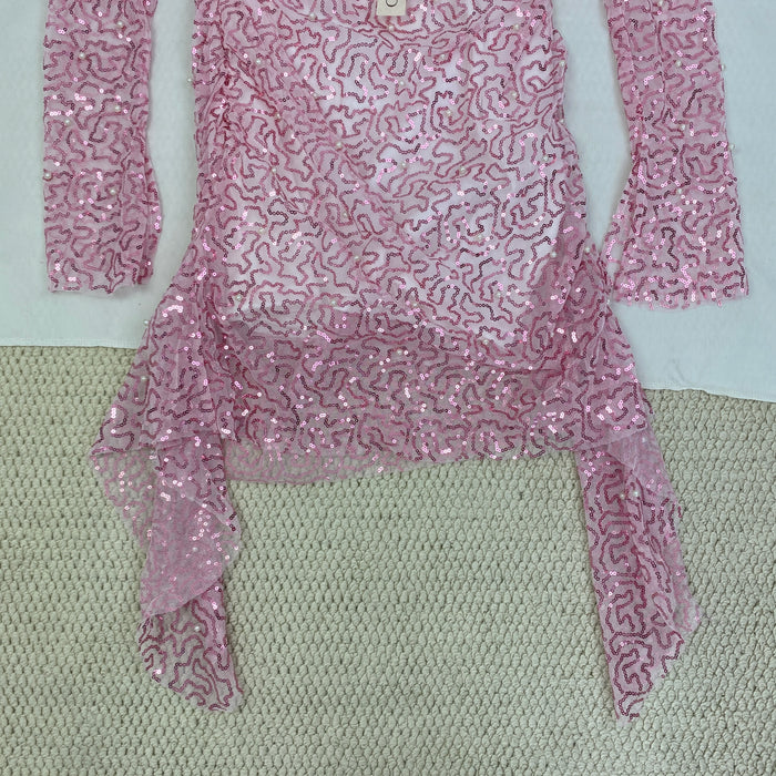 A slimming, soft pink, figure-hugging dress
