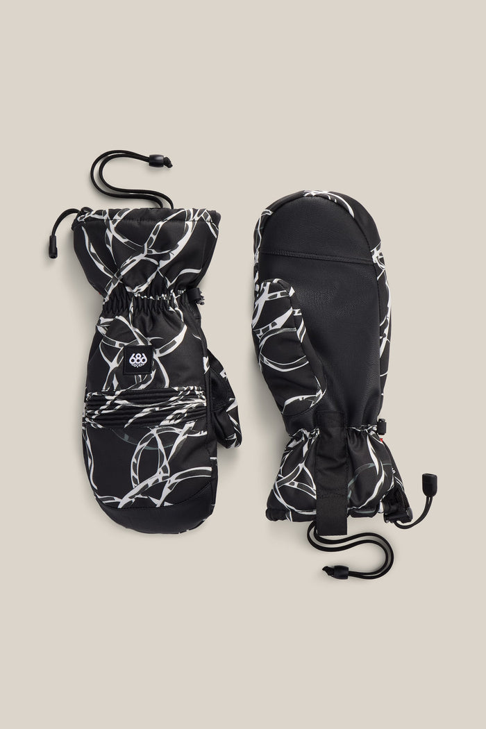 A pair of 686 Men’s Lander™ Mitts in black featuring a white abstract pattern, adjustable wrist straps, and drawstring closures, displayed on a beige background.