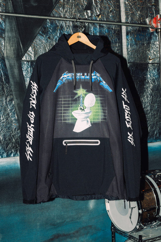686 Men’s Metallica Waterproof Hoody in black polyester, featuring a Metallica logo above a toilet and sword graphic on the chest with text printed along the sleeves.