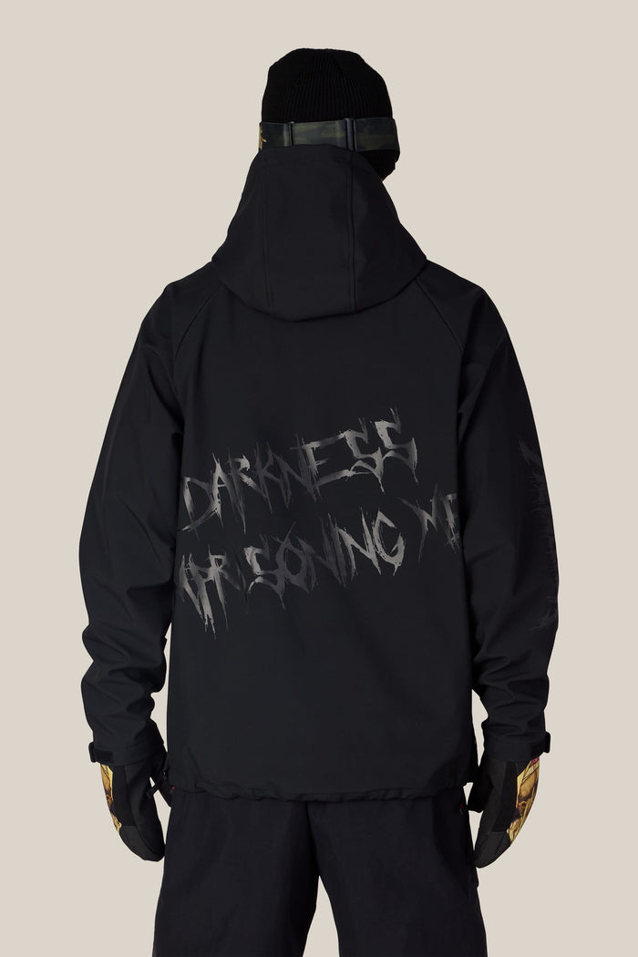 Back view of a person wearing a black polyester 686 Men’s Metallica Waterproof Hoody with the text DARKNESS IMPRISONING ME printed on the back.