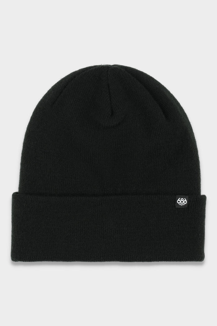 The 686 Standard Roll Up Beanie by 686 is a plain black knit hat with a folded brim and a small white logo tag on the front, set against a light gray background.