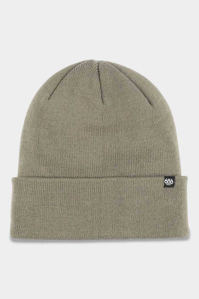 The 686 Standard Roll Up Beanie by 686 is a plain, light olive-green knit hat featuring a folded brim and a small black logo tag on the cuff, displayed on a white background.