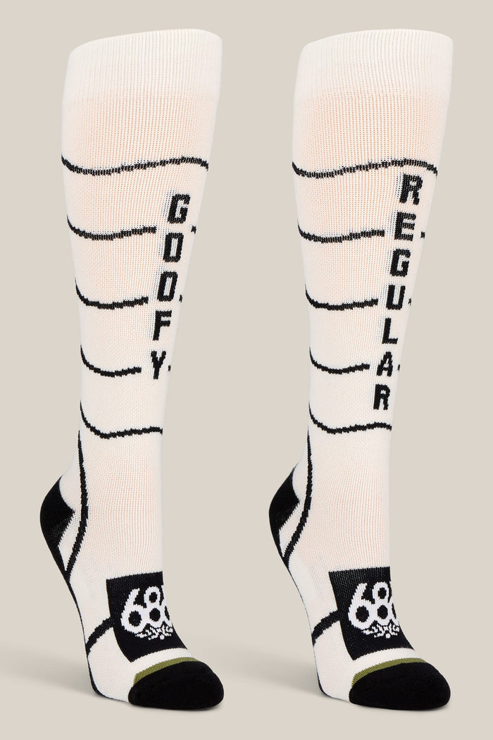 Step up your sock game with the 686 Women’s Contour Merino Sock - 2-Pack from 686—featuring bold white and black knee-high designs, playful “GOOFY” and “REGULAR” text on each sock, stylish horizontal stripes, and a signature logo near the toes. These performance socks are perfect for women seeking both comfort and a fun twist in their collection.
