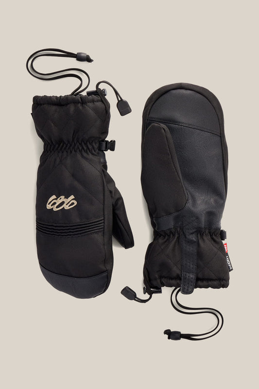 Two 686 Women’s Jubilee™ Mitts in black are displayed on a neutral background, showing both the palm and back sides. One mitten features stitched detailing and a small embroidered 686 logo, with drawstring cords for insulation.