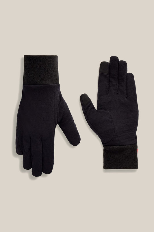 Two black 686 Women’s Merino Glove Liners are displayed on a beige background, with one glove showing the palm side and the other showing the back side.