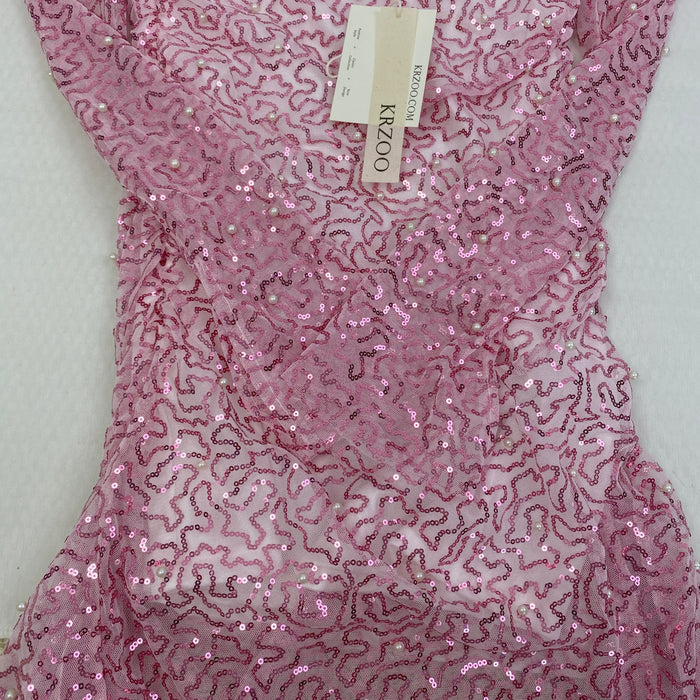 A slimming, soft pink, figure-hugging dress