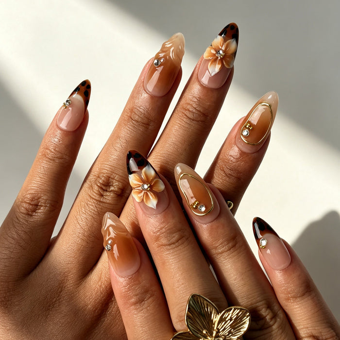 Romantic almond false nails, soft nude pink base, brown flower, white French tip, gold frame and 3D gradient flower