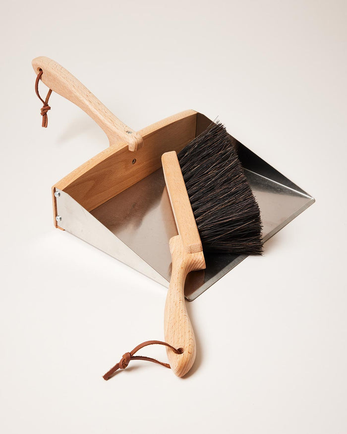 Beechwood Dustpan and Arenga Brush — overhead view of brush resting in dustpan; Redecker, curated by Farmhouse Pottery