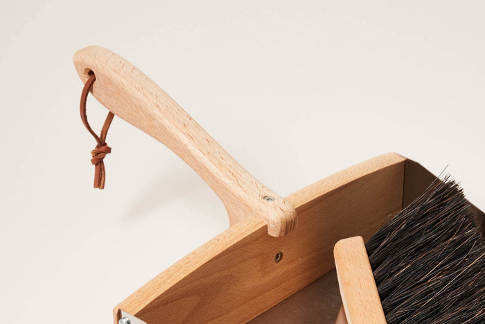 Beechwood Dustpan and Arenga Brush — close view of wooden handles and dark bristles; Redecker, curated by Farmhouse Pottery