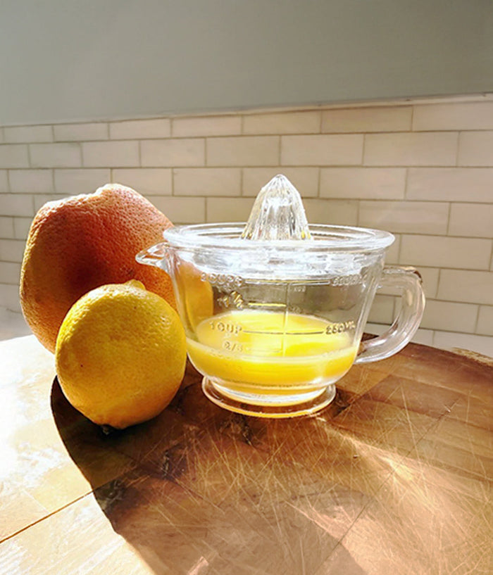 Classic Glass Manual Citrus Juicer — in a styled setting
