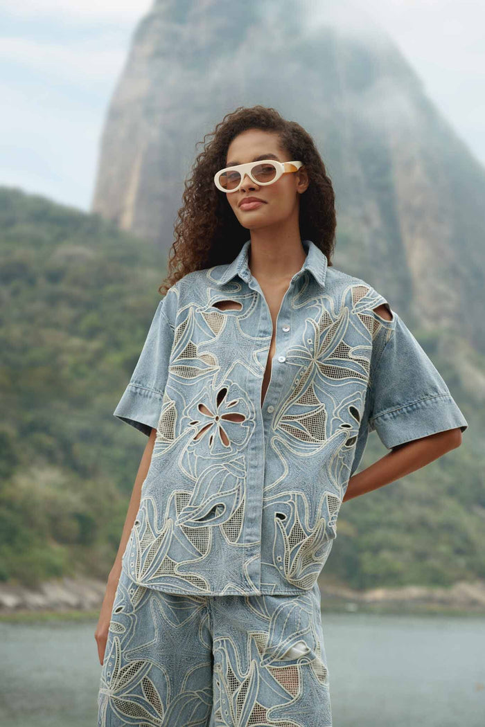FARM Rio model wearing the Denim Sea Desire Embroidered Short Sleeve Shirt