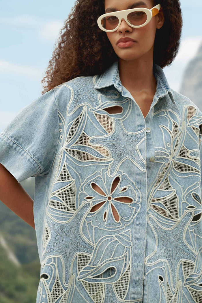 FARM Rio model wearing the Denim Sea Desire Embroidered Short Sleeve Shirt