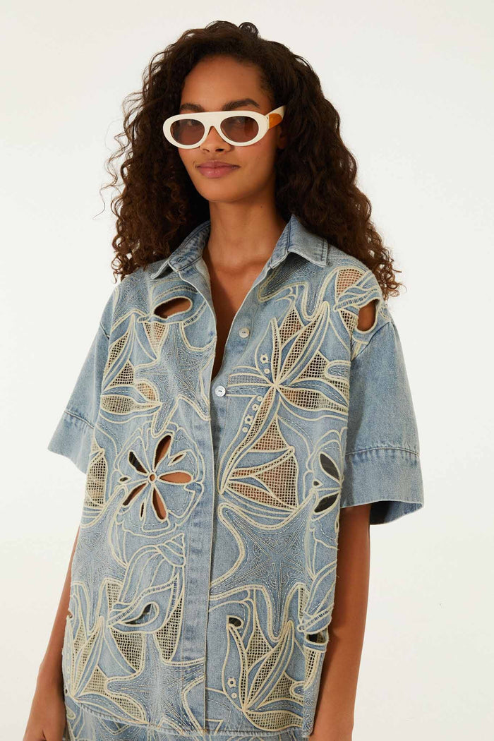 FARM Rio model wearing the Denim Sea Desire Embroidered Short Sleeve Shirt