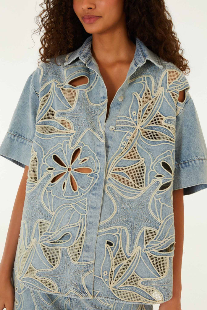 FARM Rio model wearing the Denim Sea Desire Embroidered Short Sleeve Shirt