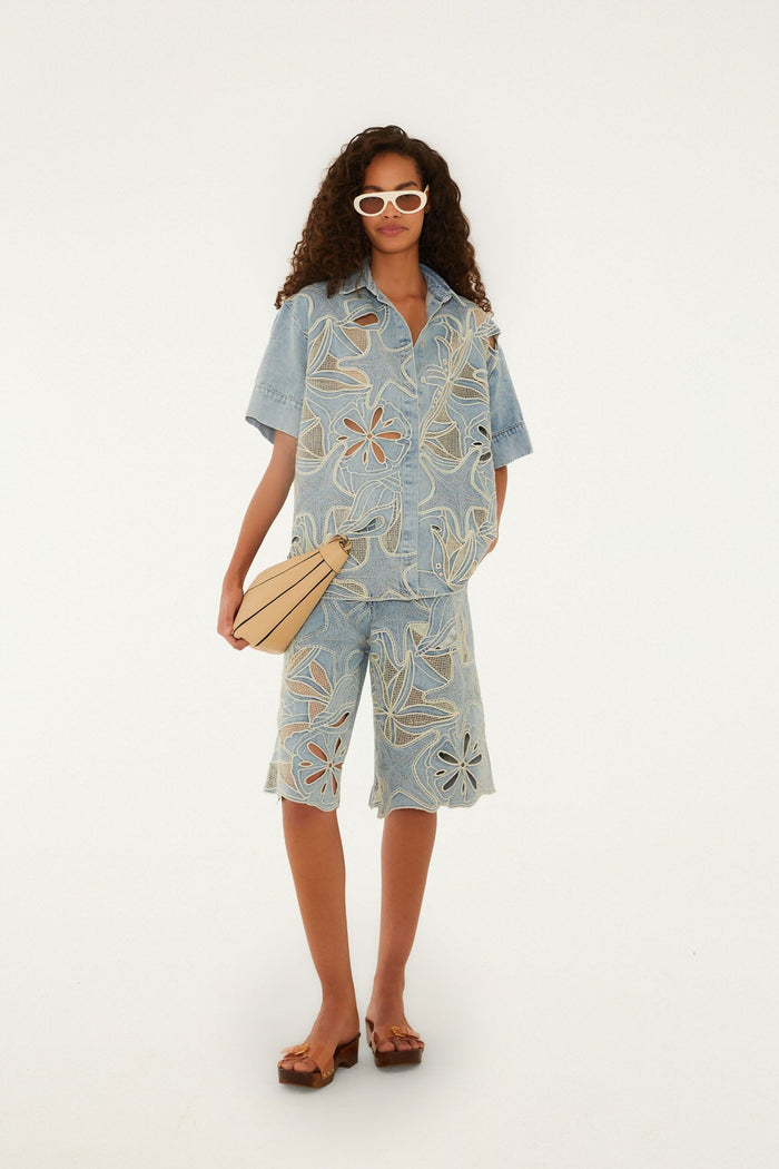 FARM Rio model wearing the Denim Sea Desire Embroidered Short Sleeve Shirt
