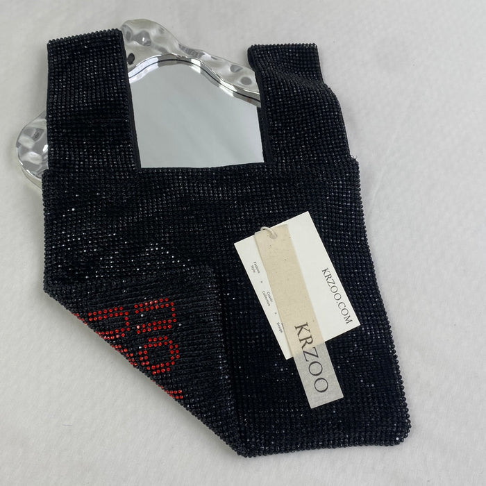 Diamond-studded heart-shaped handbag