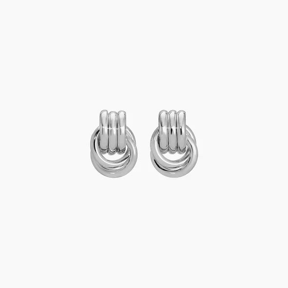 Pair of silver hoop earrings on a white background