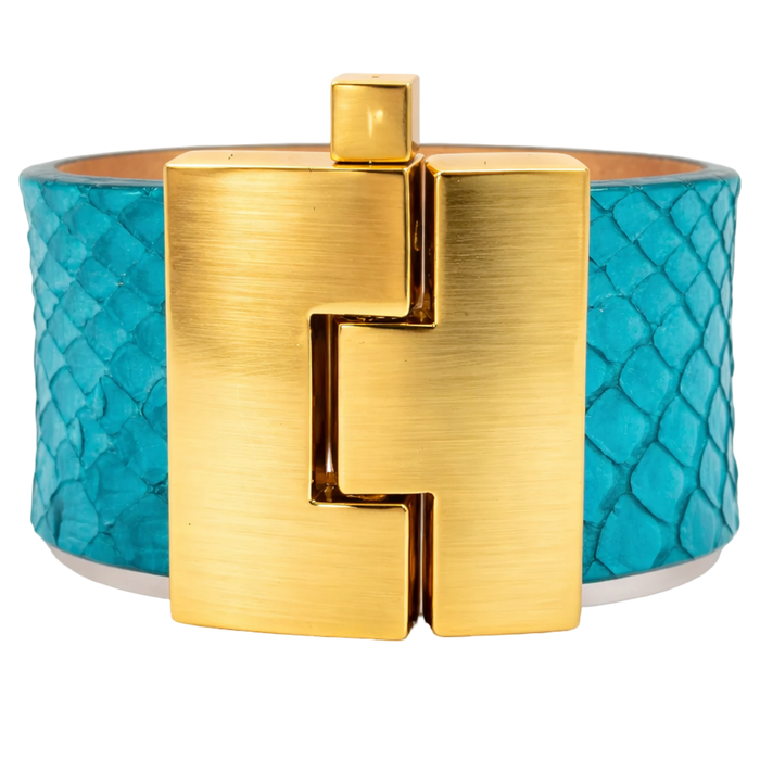 Turquoise bracelet with gold clasp on a white background