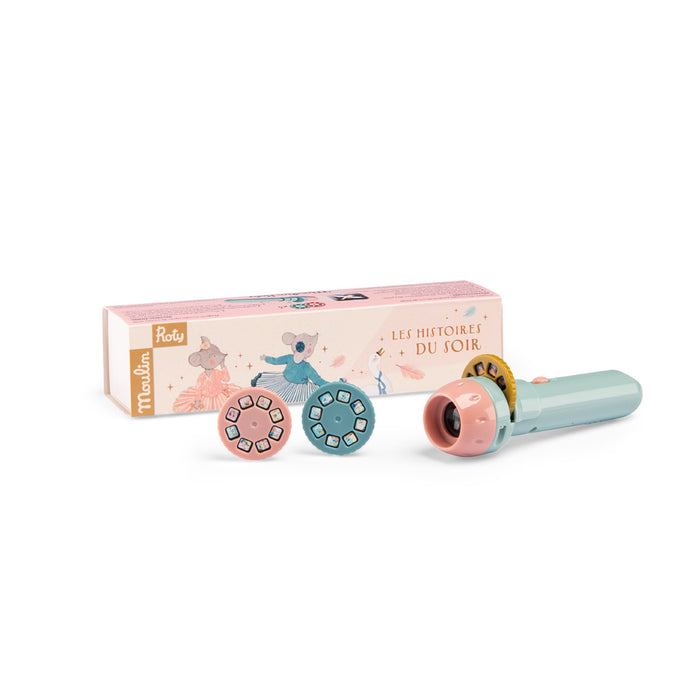 Toy with wheels and a microphone in front of its packaging on a white background