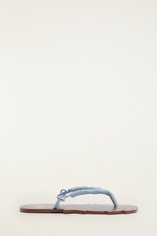 FARM Rio model wearing the Palmtree Cuoio Flat