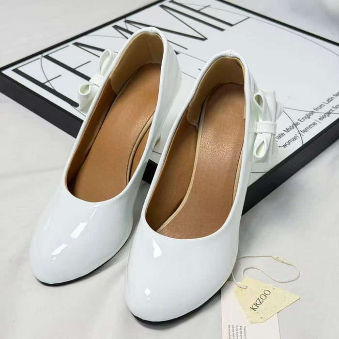 Pegged bow leather shoes