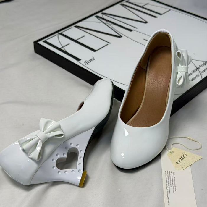 Pegged bow leather shoes