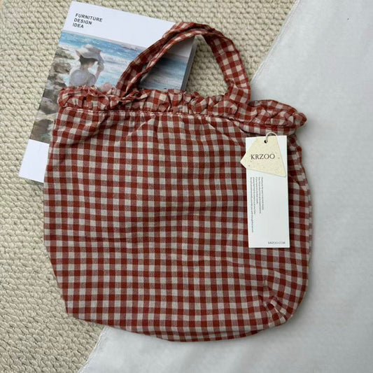 Small Red Handbag With A Checkered Pattern