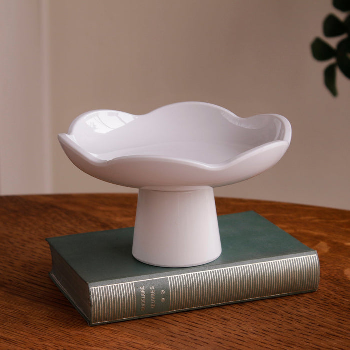 Beatriz Ball Vida Amelia Small Pedestal White — Empty pedestal on a book
