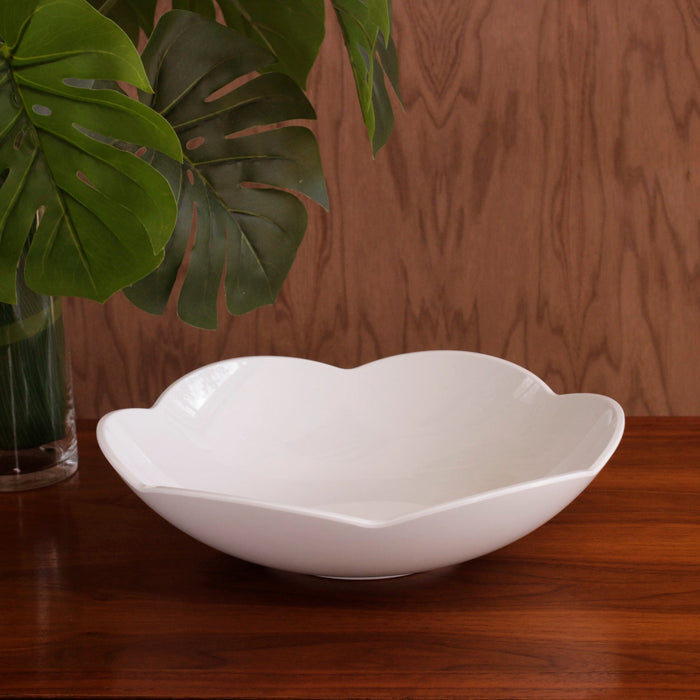 Beatriz Ball Vida Amelia Medium Bowl White — Empty bowl beside large green leaves