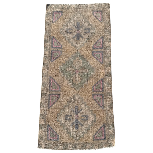 Vintage-style rug with geometric pattern on a white background
