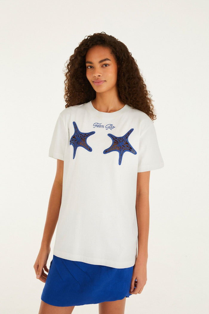 FARM Rio model wearing the White Farm Rio Starfish Cut-Out Organic Cotton T-Shirt