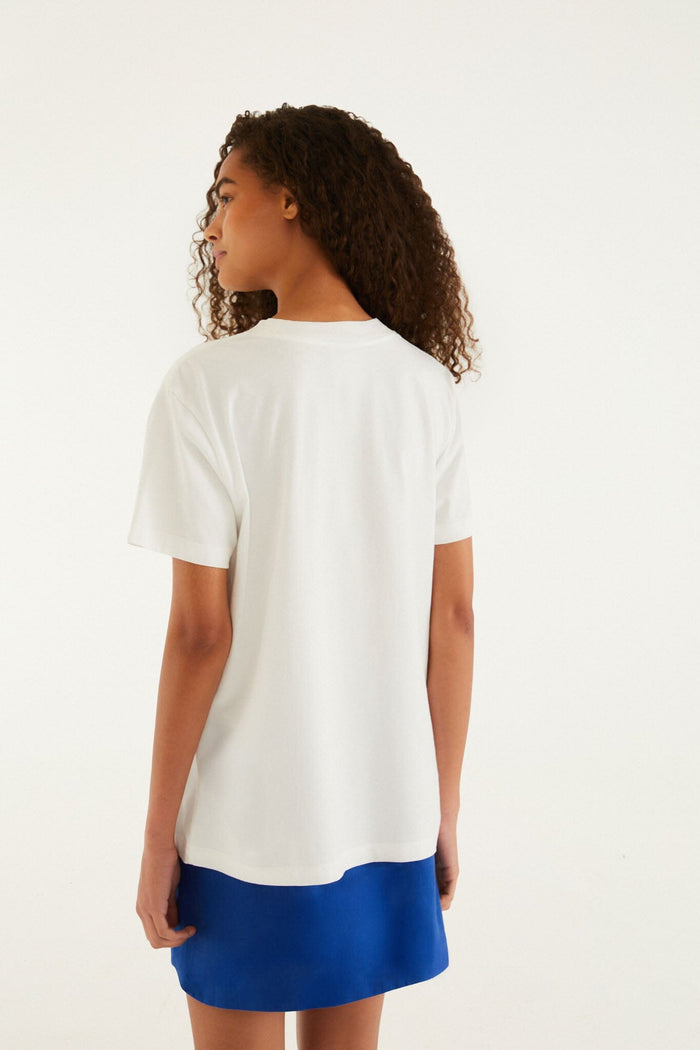 FARM Rio model wearing the White Farm Rio Starfish Cut-Out Organic Cotton T-Shirt